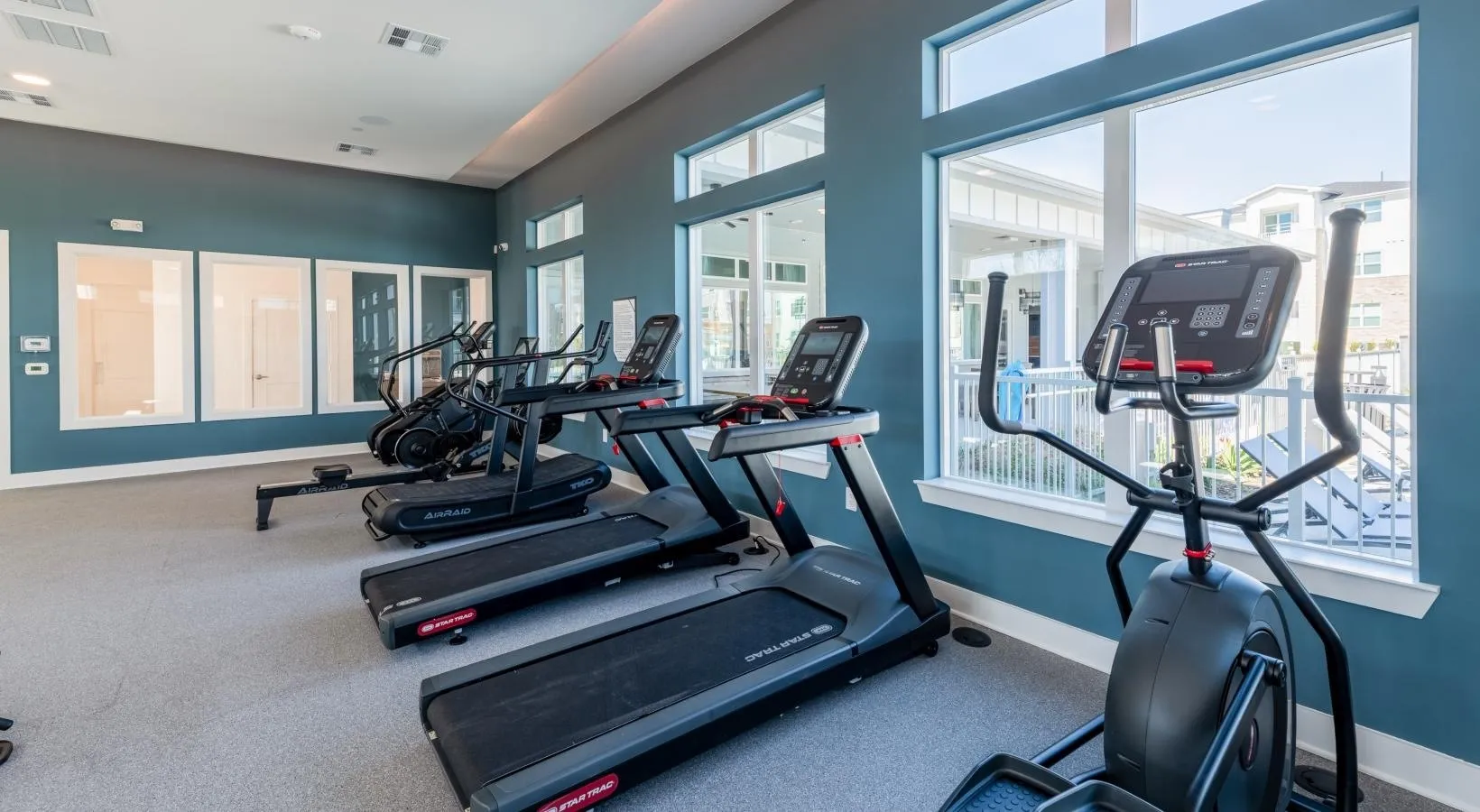 24-hour fitness center with cardio equipment