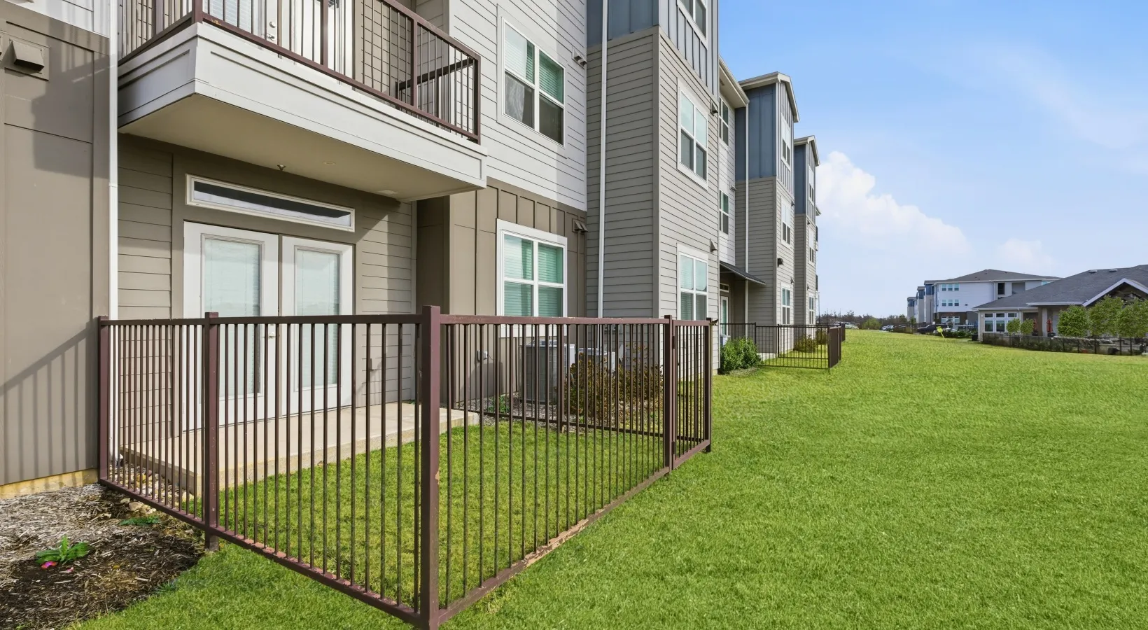 Building exterior with private fenced yards