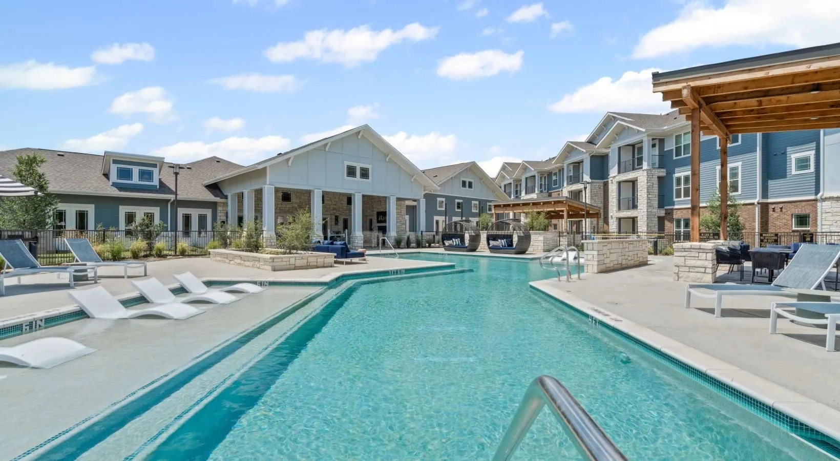 Resort-style pool with expansive sundeck