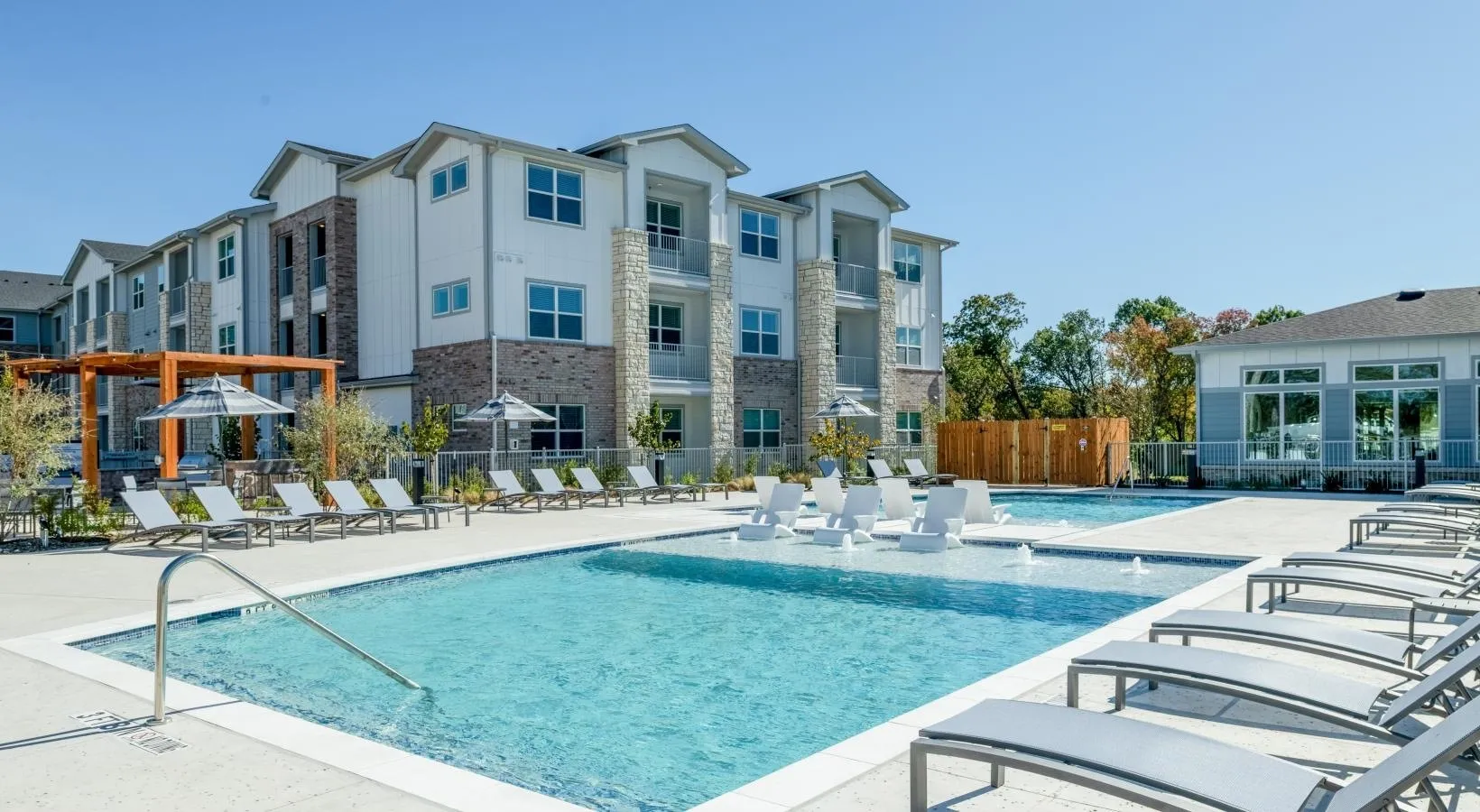Resort-style swimming pool with sundeck