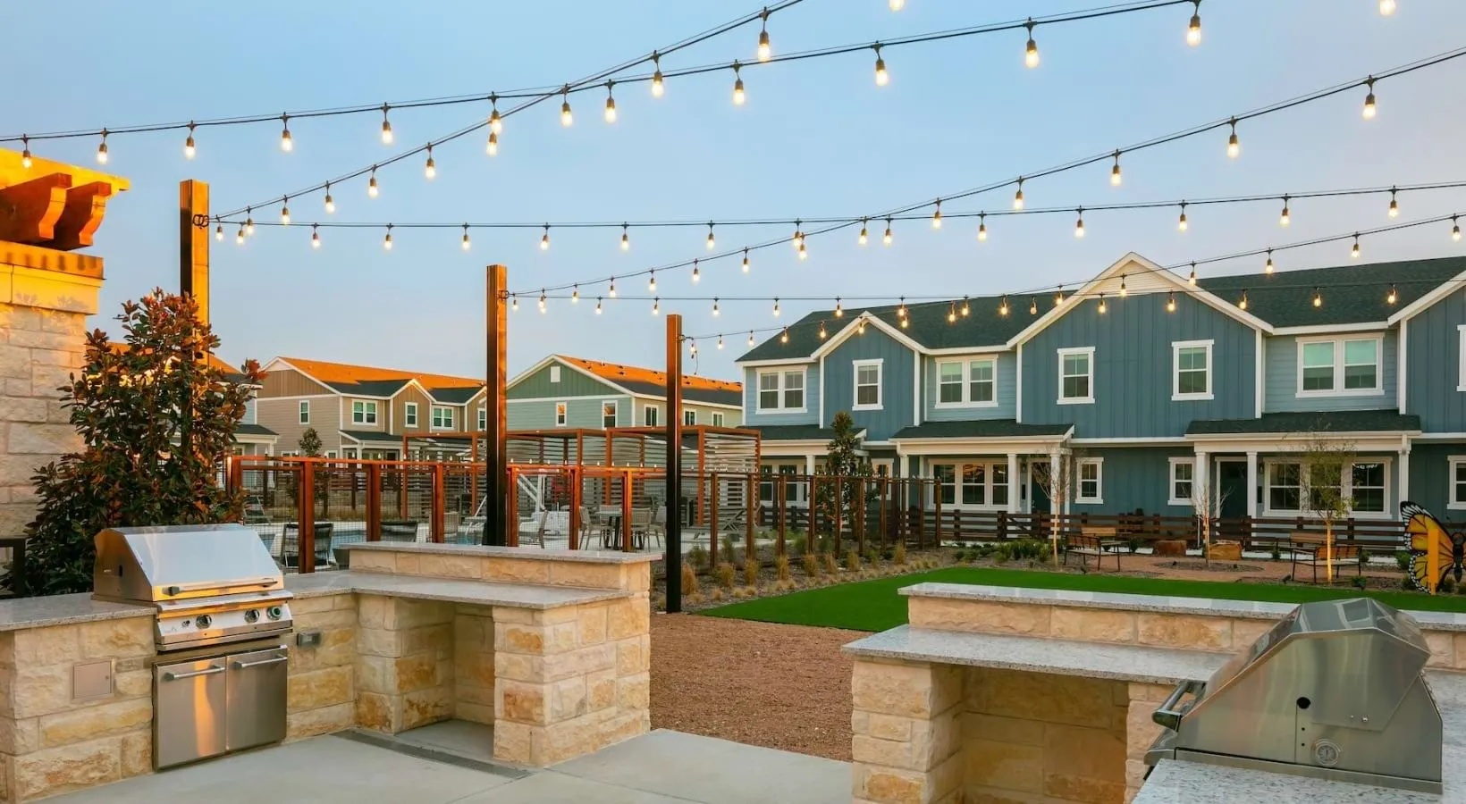 Outdoor grilling pavilion with string lights