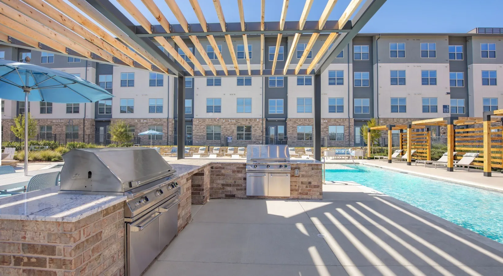 Outdoor kitchen with gas grills