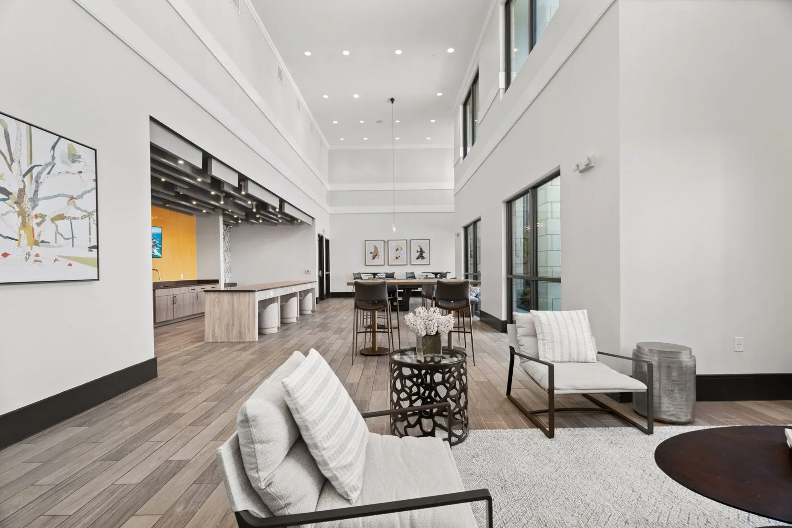 A modern living room with a white couch and a coffee table. at Axis at Watters Creek