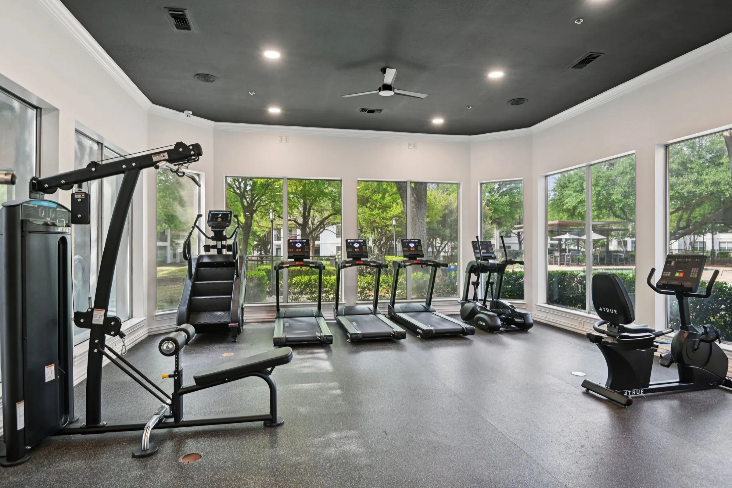 23Hundred at Ridgeview - Bright and spacious gym with various exercise equipment and large windows