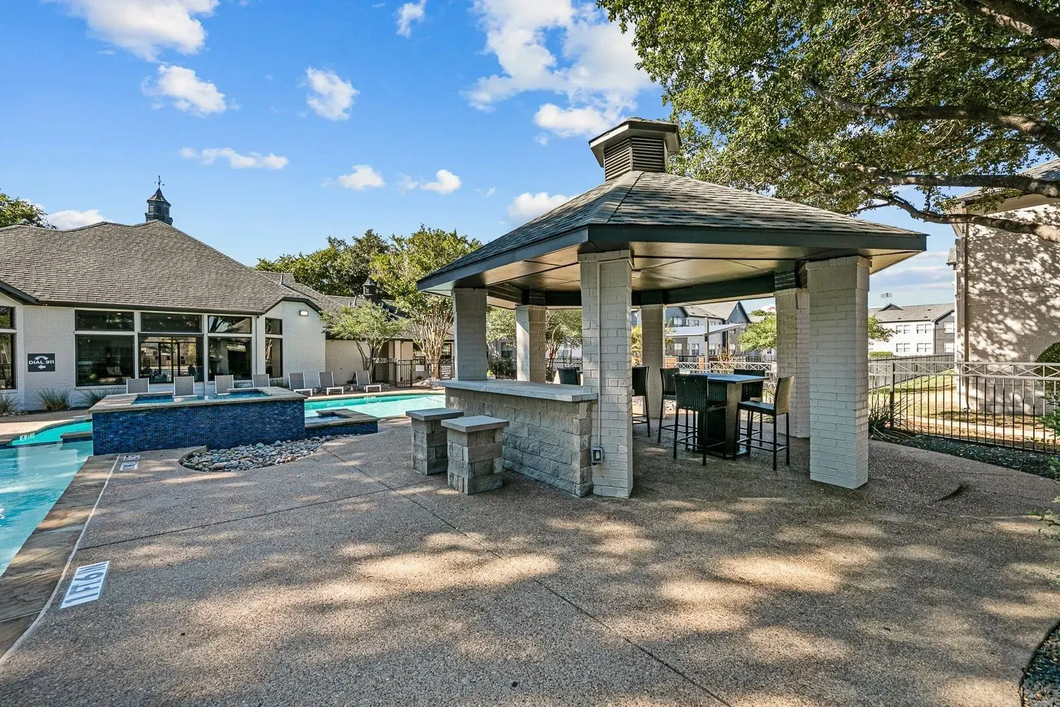Poolside pavilion with grills and picnic seating at 29Fifty