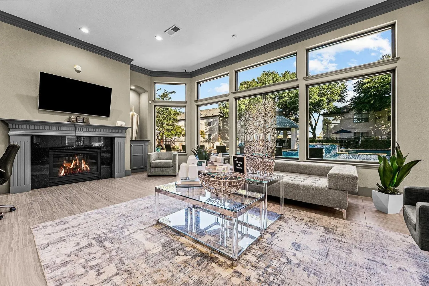 Clubhouse lounge with fireplace and floor-to-ceiling windows at 29Fifty