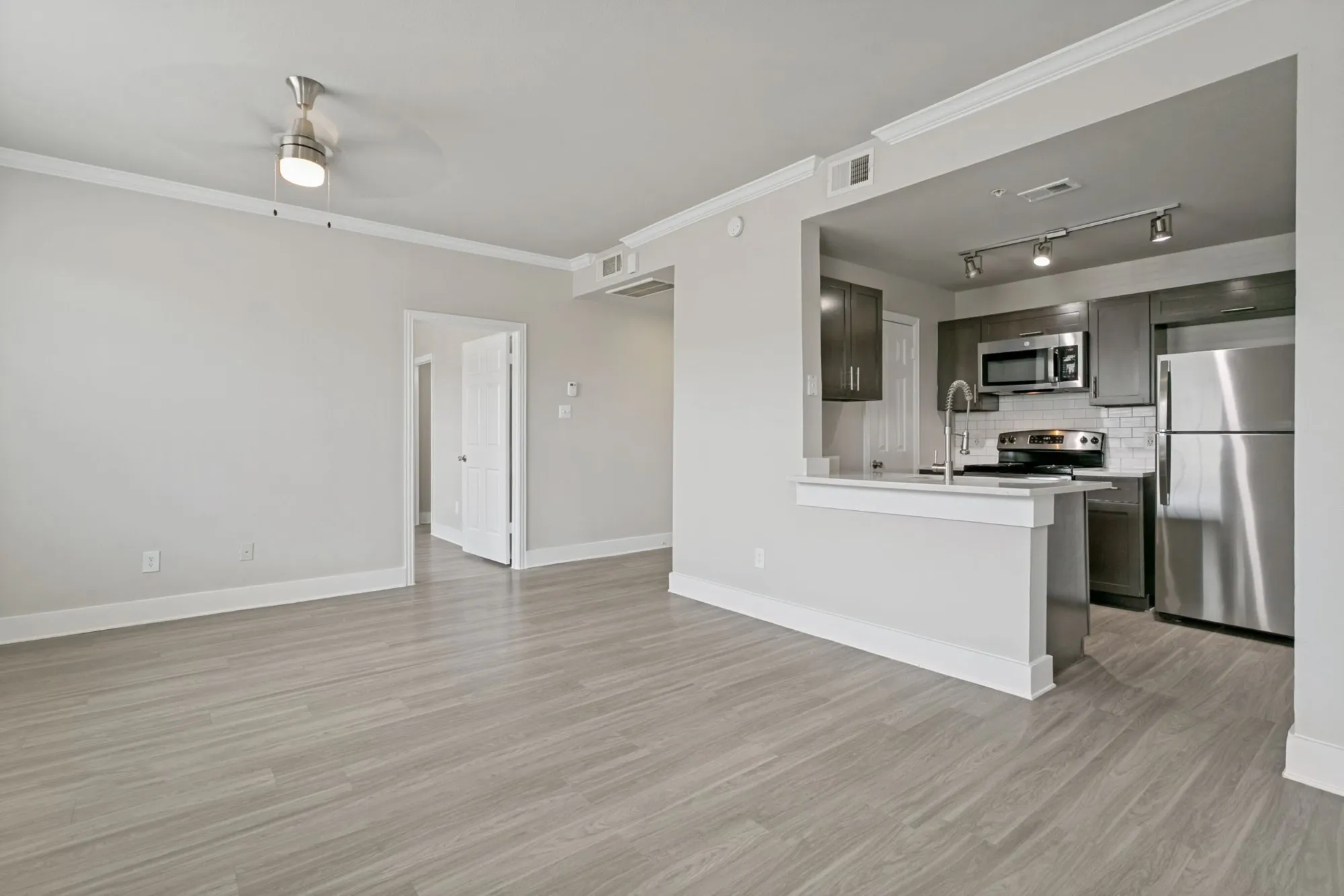 Living area with breakfast bar overlooking the kitchen at 29Fifty