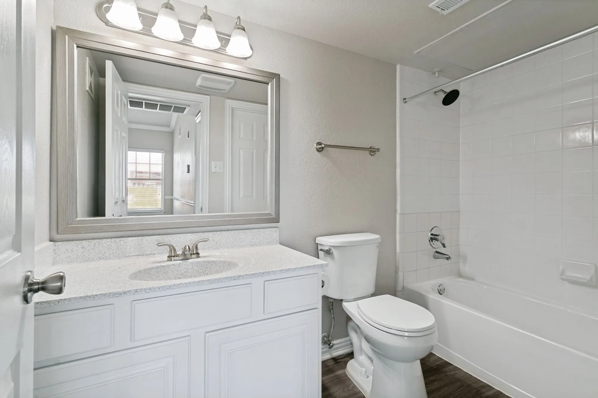 Bathroom with framed mirror and tub-shower at 29Fifty