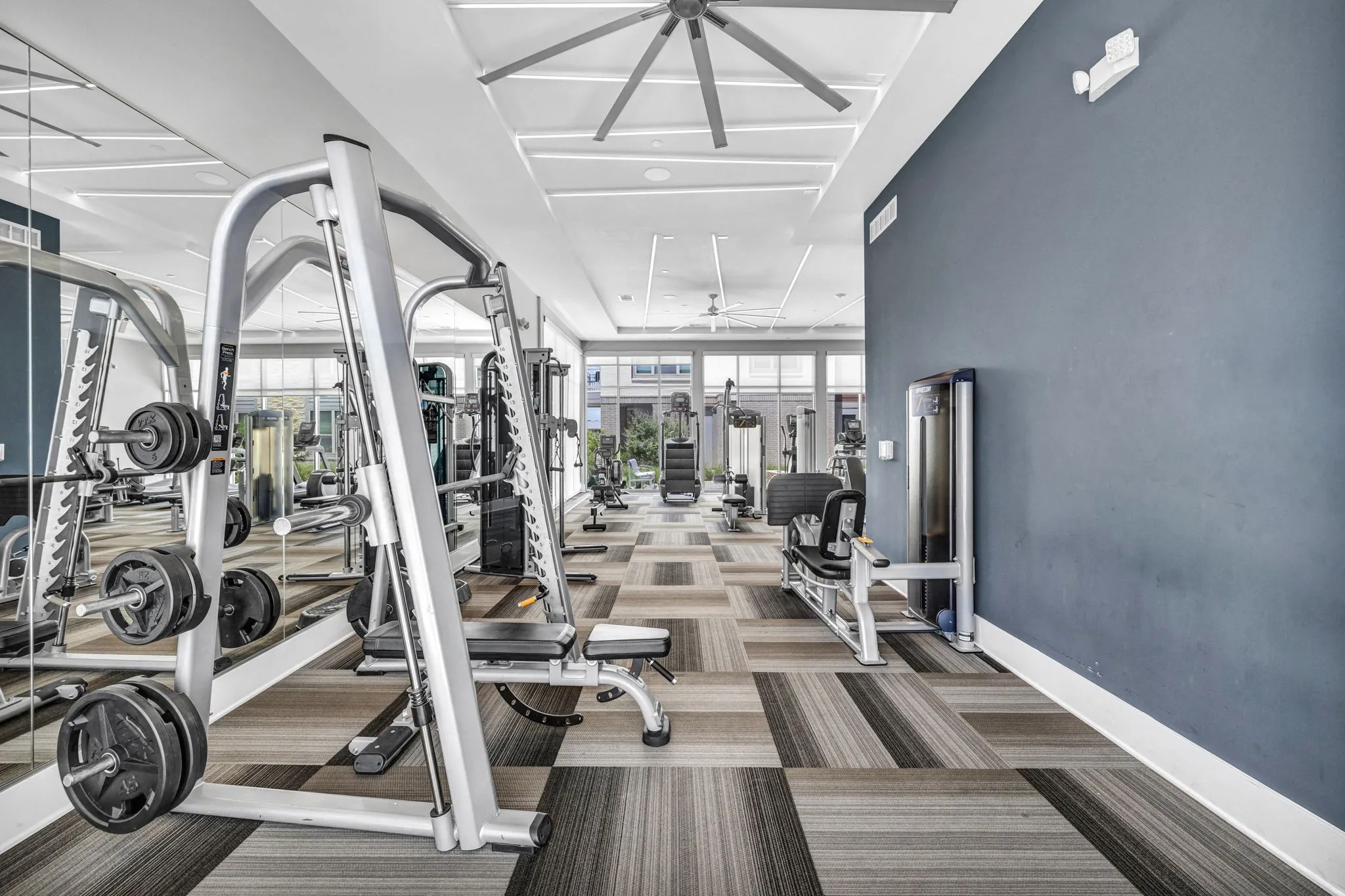 26 at City Point - A gym with a variety of equipment including treadmills, weights, and exercise machines