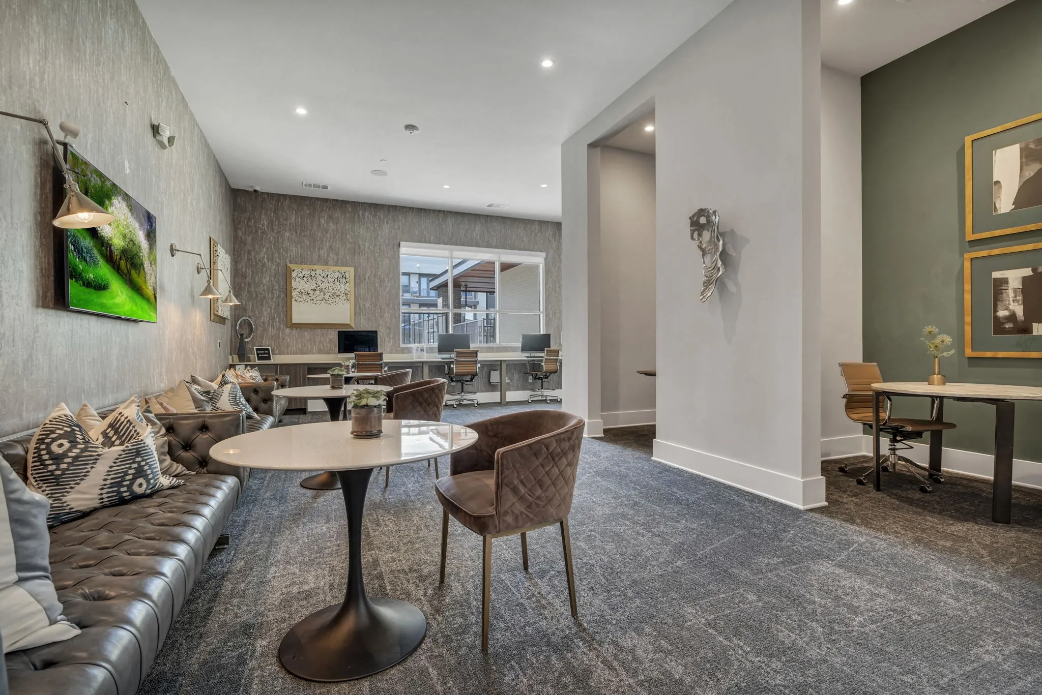 26 at City Point - A modern living room with a grey carpet and a white table