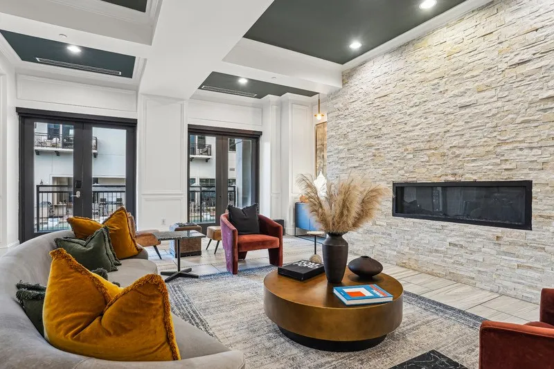 Cantabria at Turtle Creek - Clubroom with stone fireplace and lounge seating