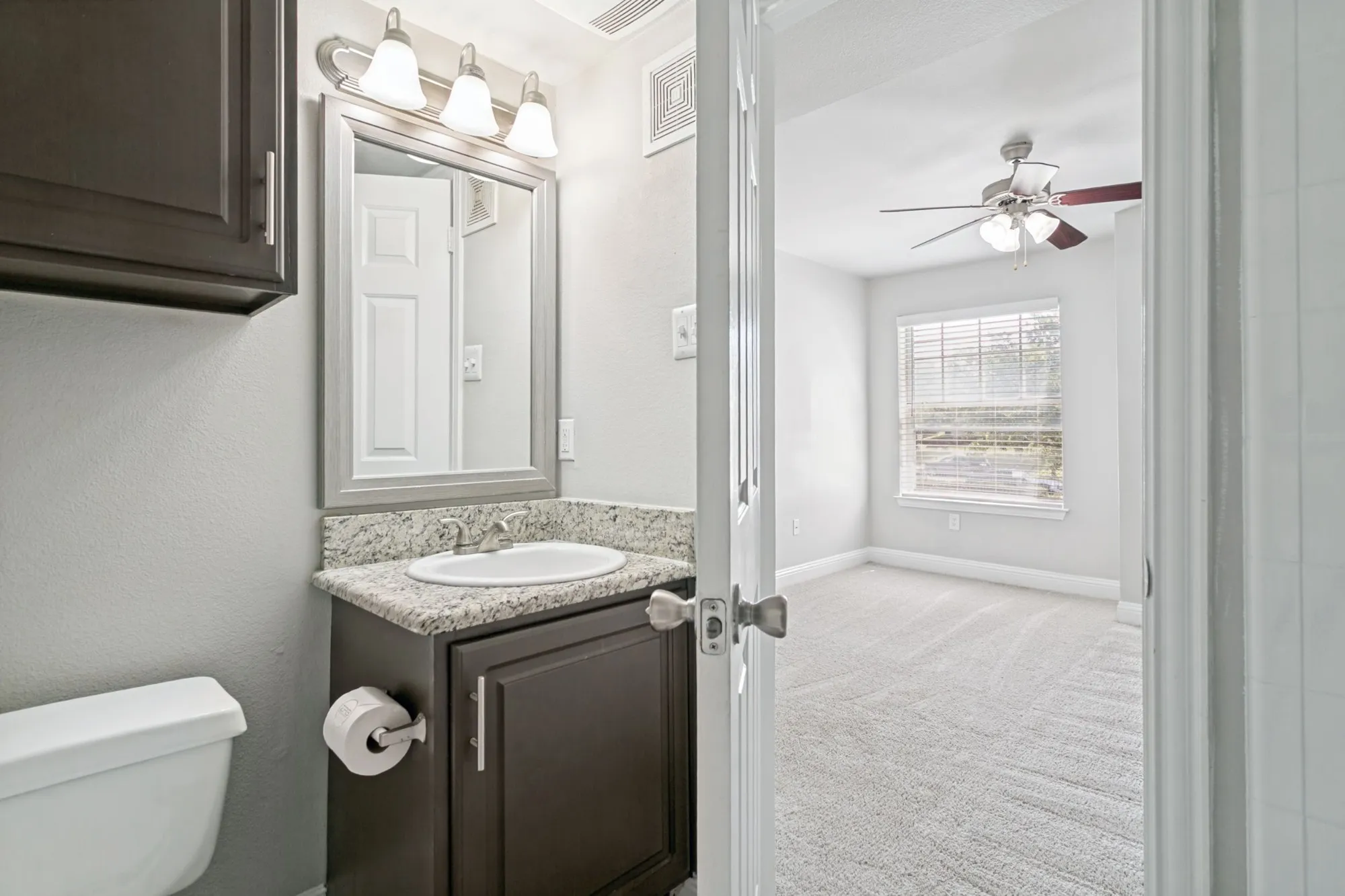Bathroom vanity with adjoining bedroom at 29Fifty