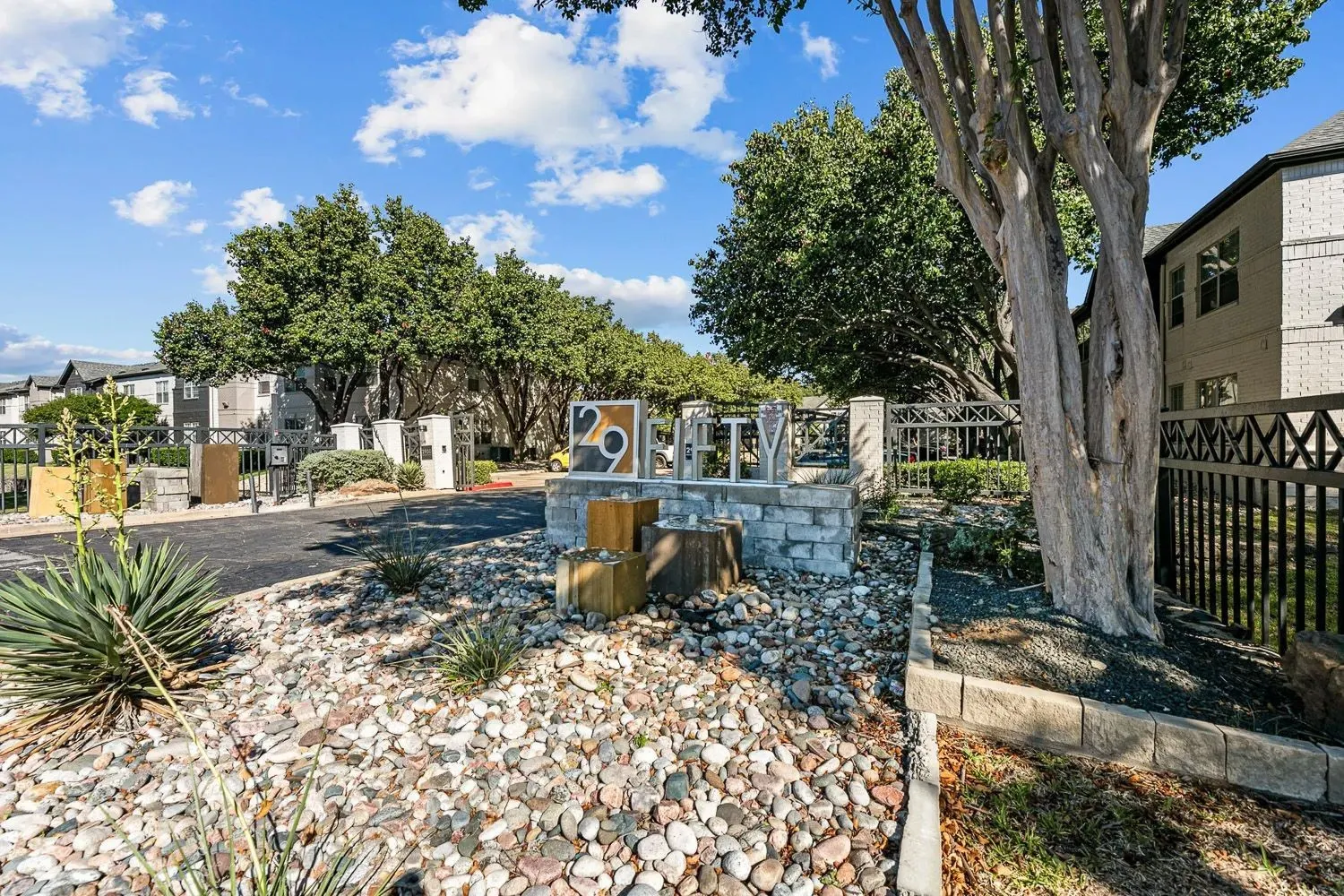 Landscaped entry at the 29Fifty monument sign at 29Fifty