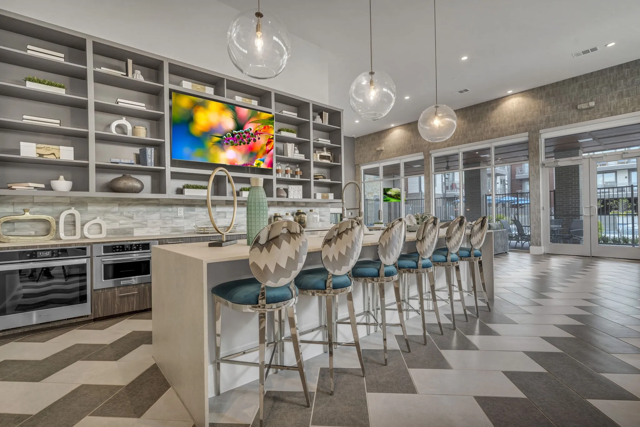 26 at City Point - A modern kitchen with a bar area and a large painting on the wall