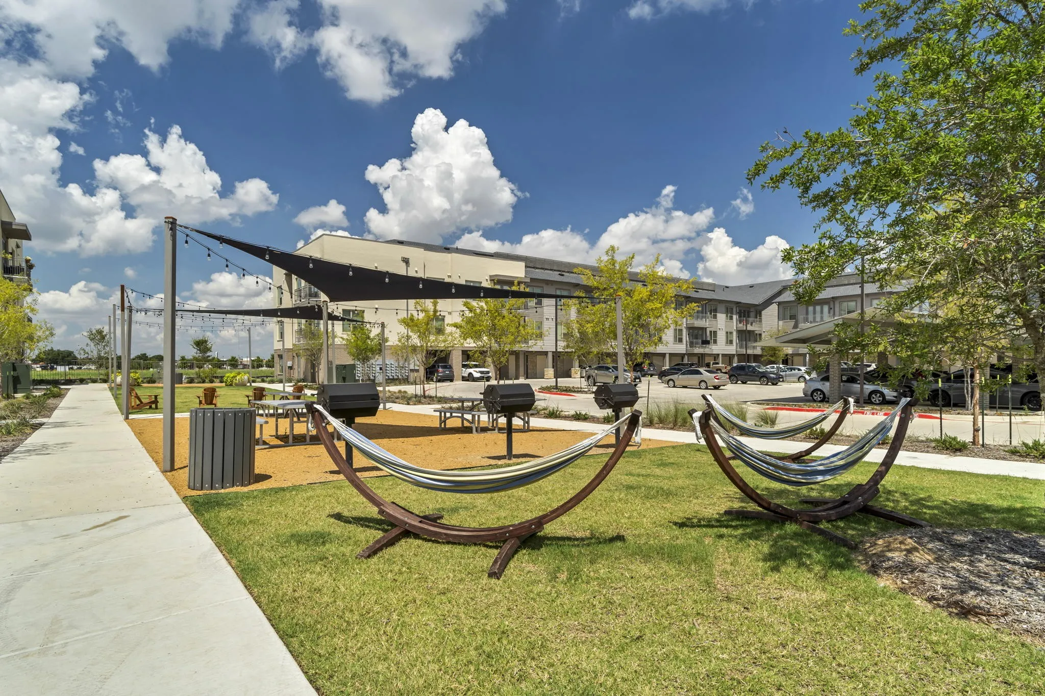 26 at City Point - A park with a hammock and a building in the background