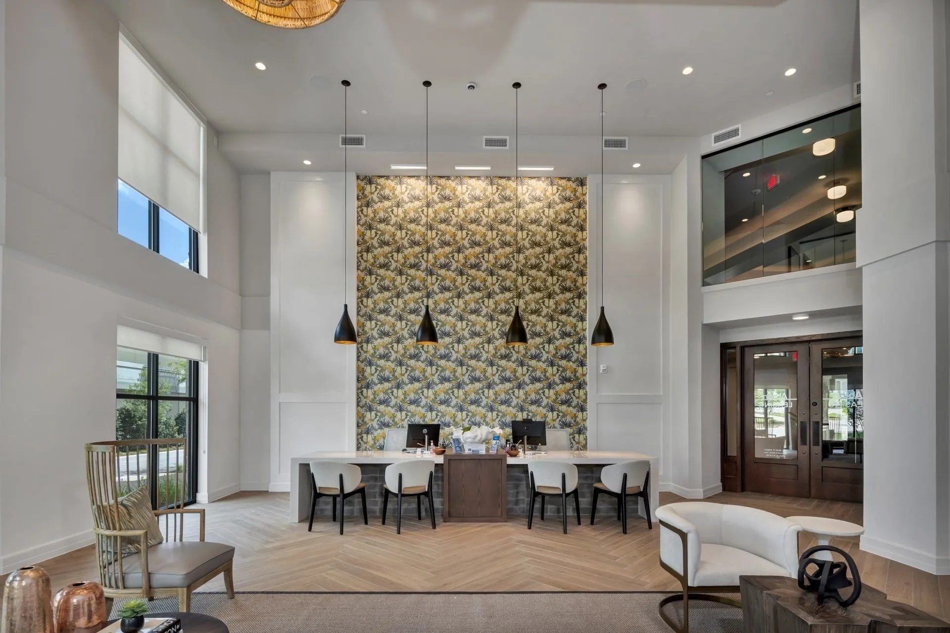 Ablon at Harbor Village - Leasing center with a long desk, tables and chairs