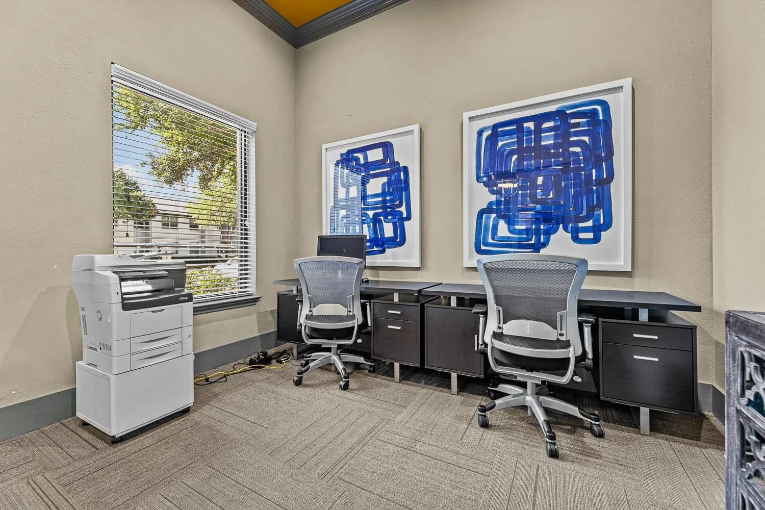 Business center with workstations and printer at 29Fifty