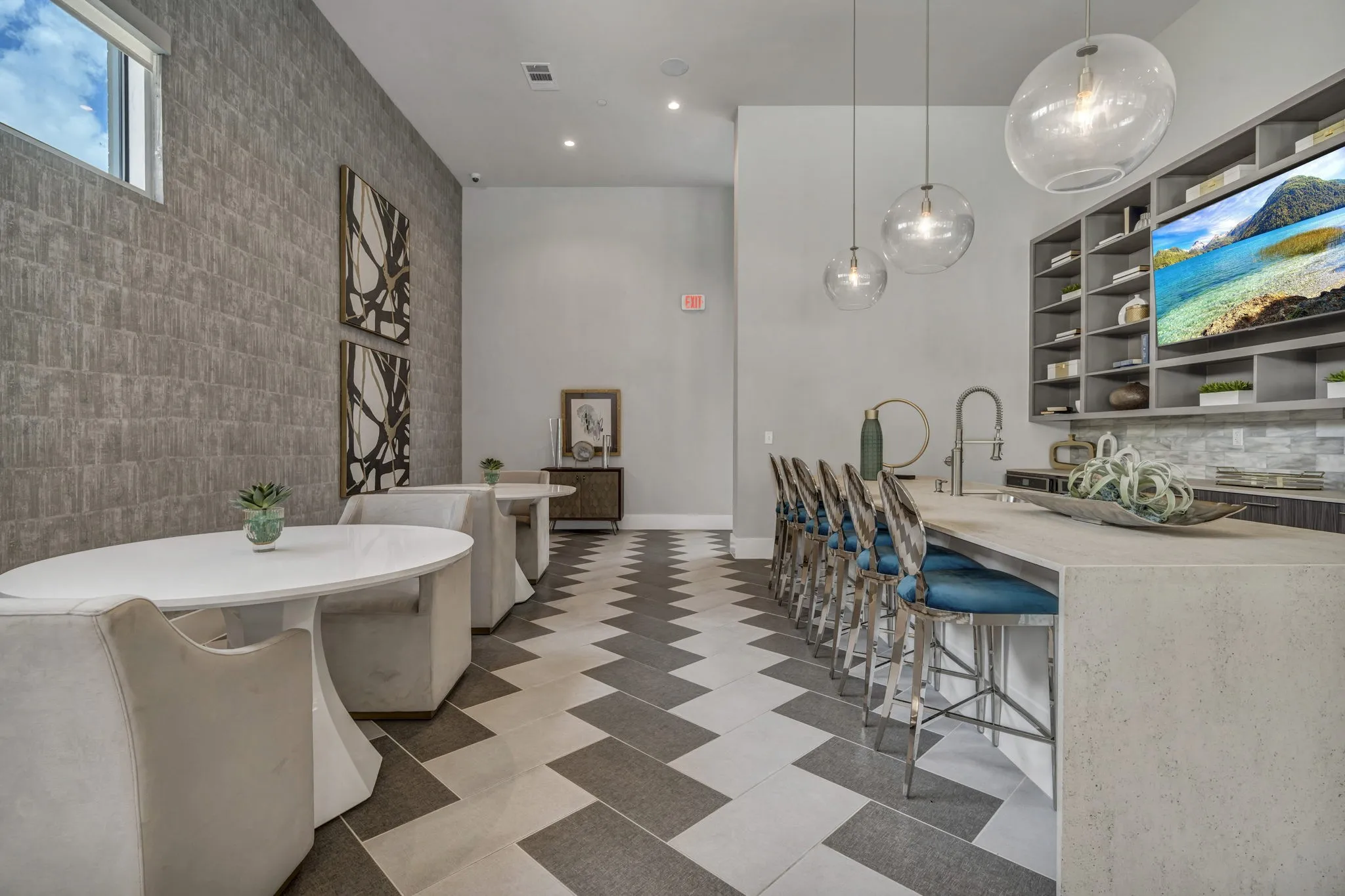 26 at City Point - A modern dining room with a long table and chairs