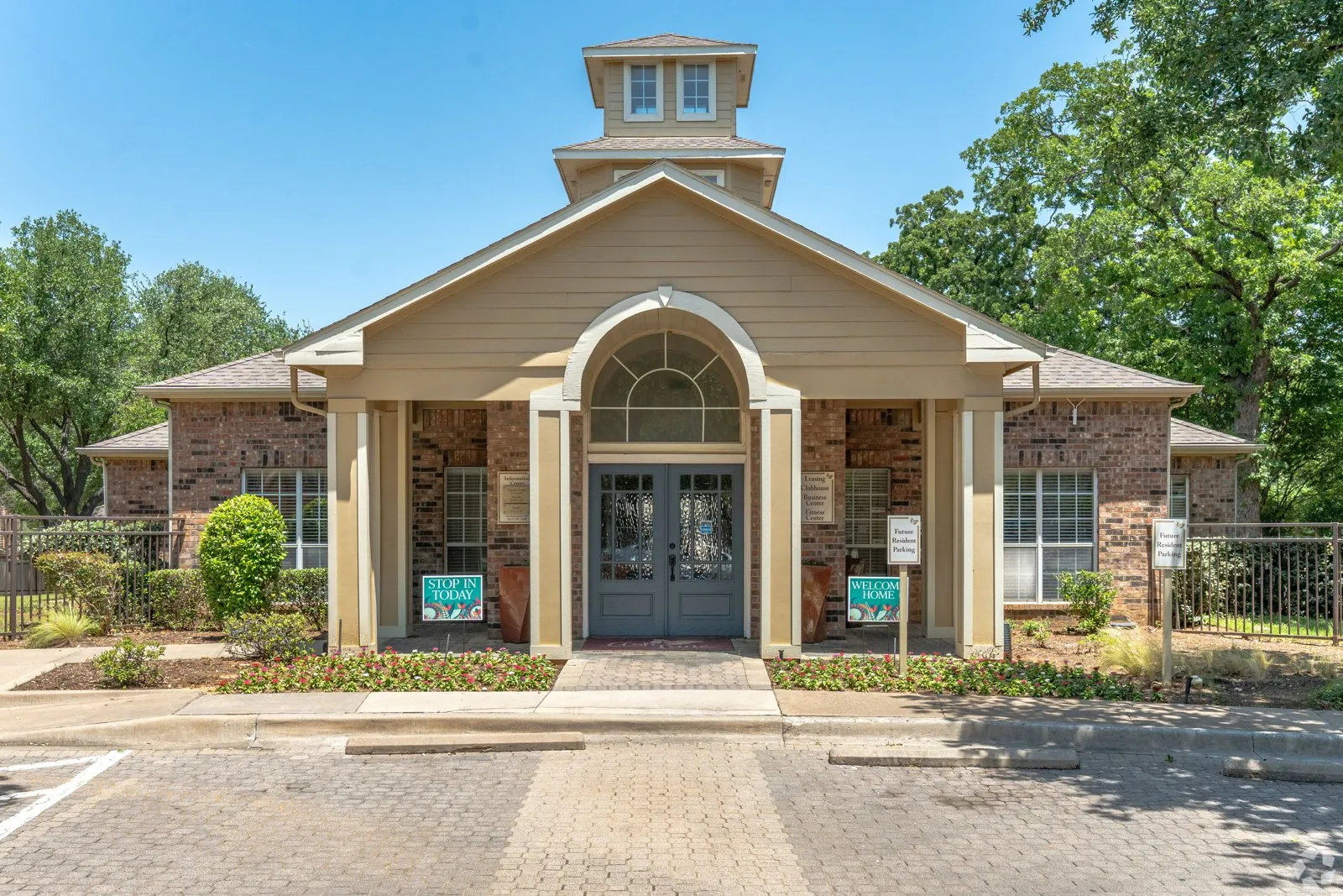A church with a sign th at Ash Lane Apartment Homes