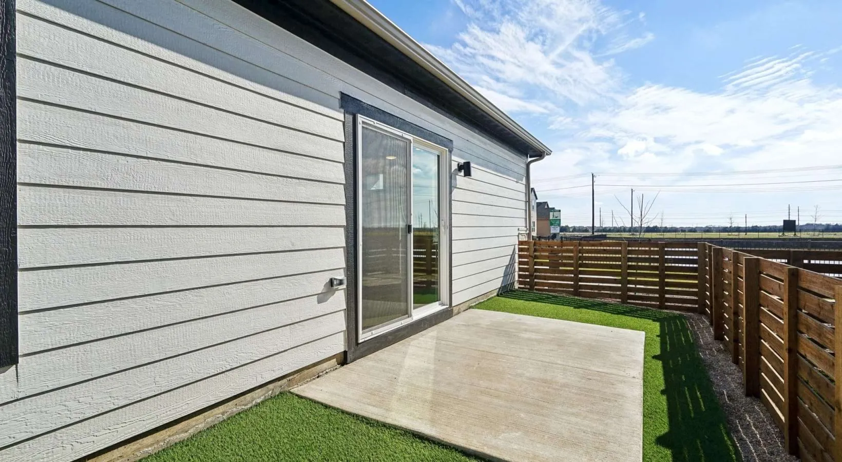 Canvas at Anna - Glenwood Floor Plan - Private, fenced-in side patio with artificial turf