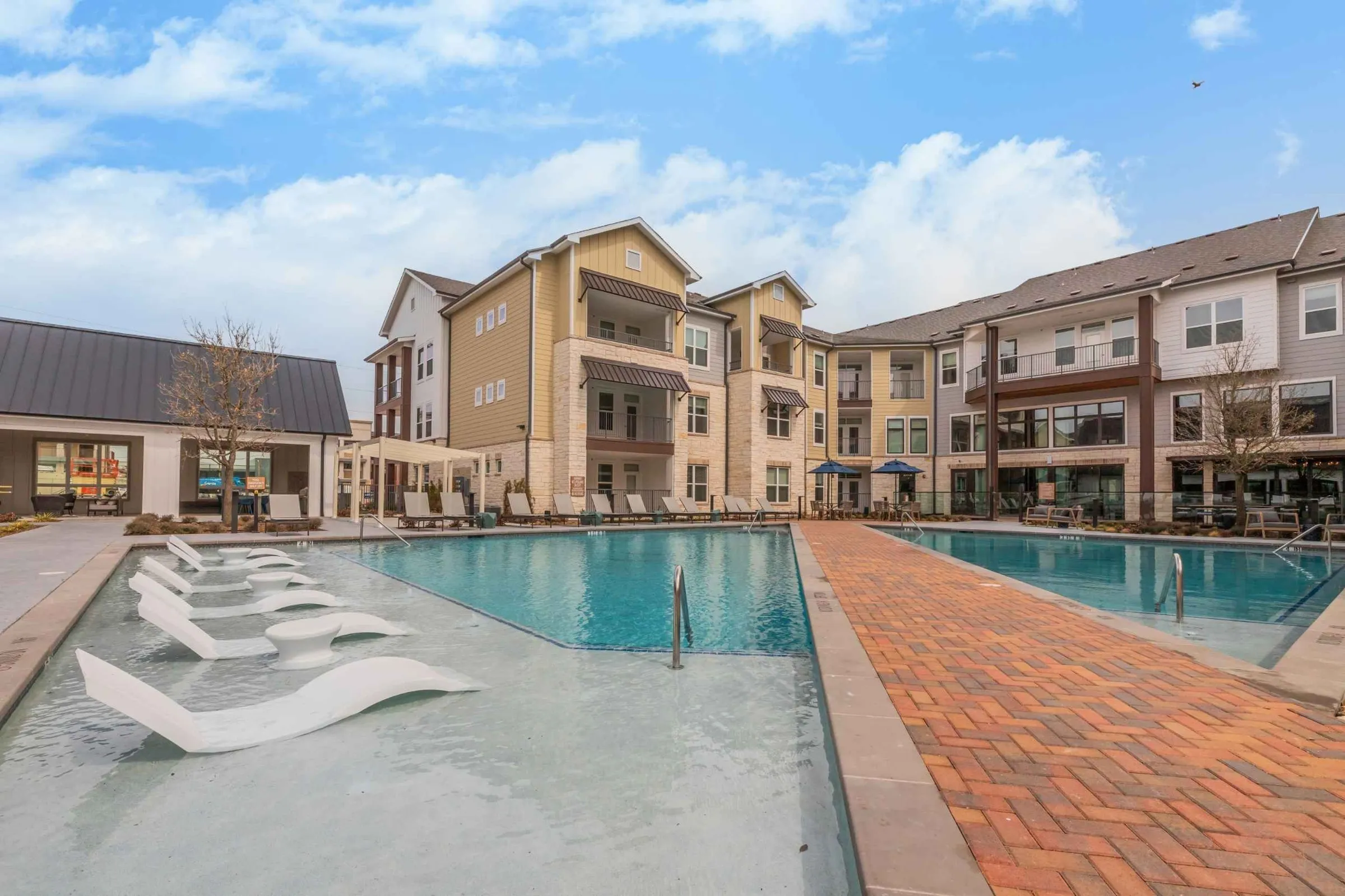 Atlas Crown - Swimming pool and sundeck with lounge chairs