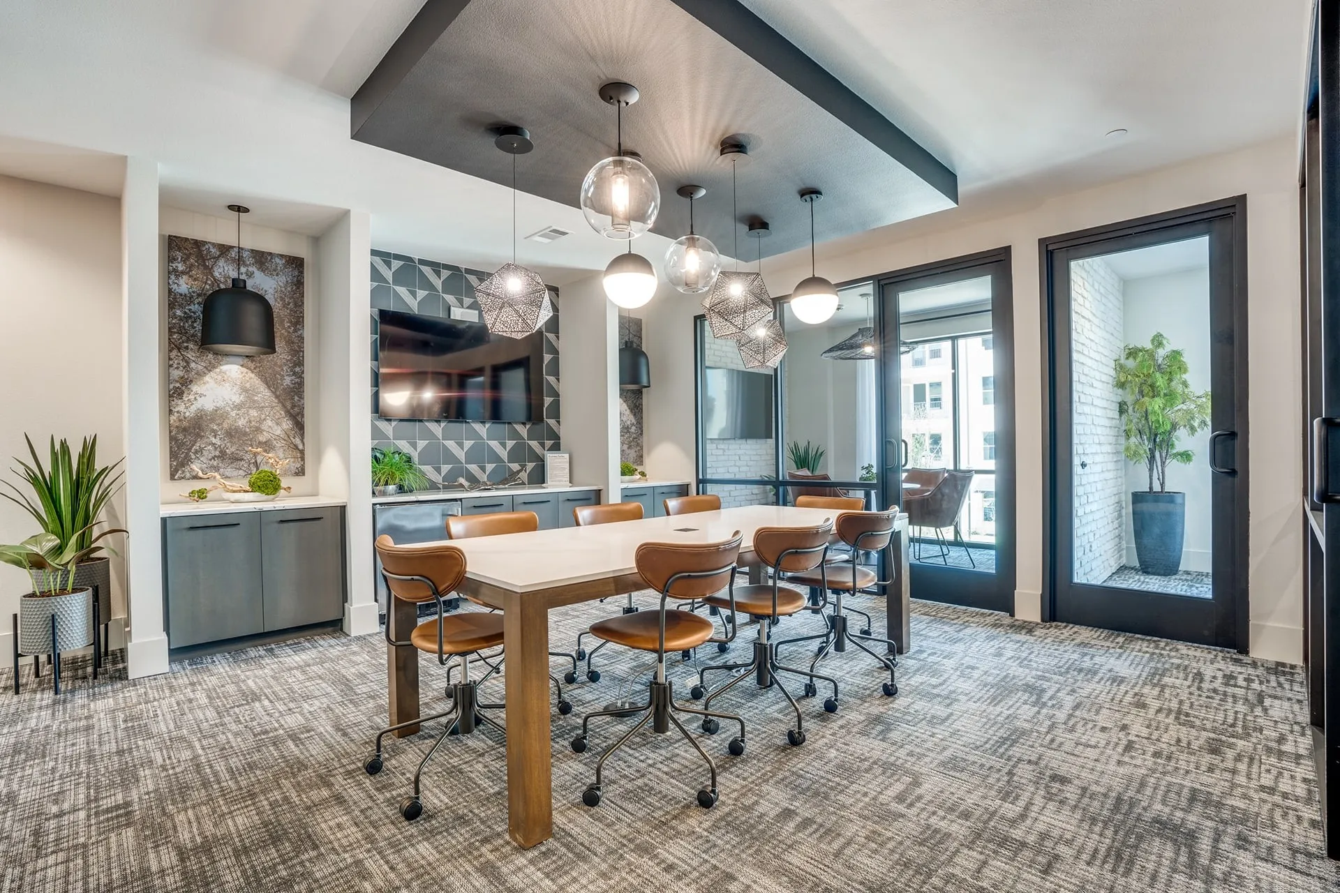 a conference room with a long table and chairs
