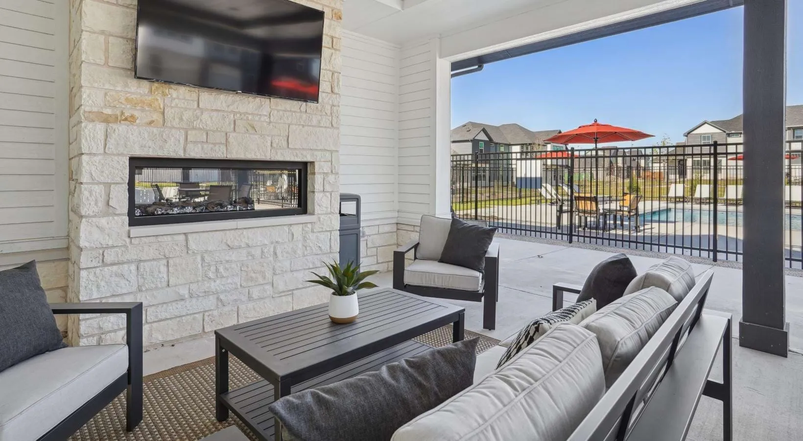 Canvas at Anna - Cozy outdoor fireplace and entertainment space